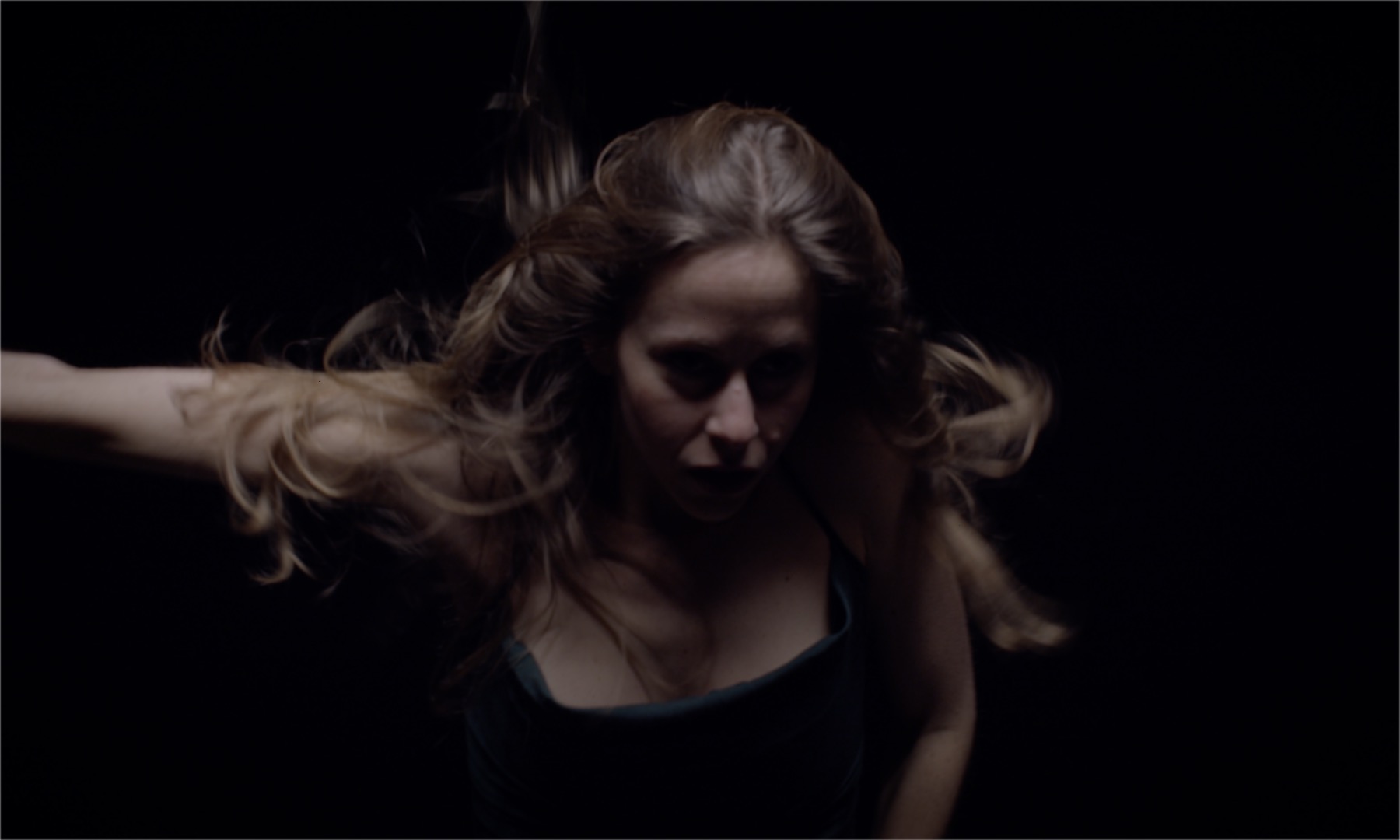 Film still showing Aline Costa dancing
