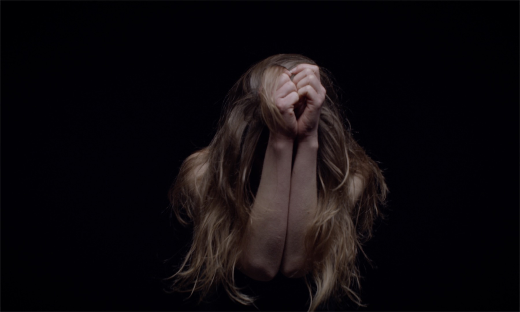Film still showing Aline Costa dancing