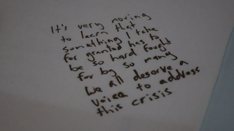 Handwritten text - "It's very moving to learn that something I take for granted has to be so hard fought for by so many. We all deserve a voice to address this crisis"